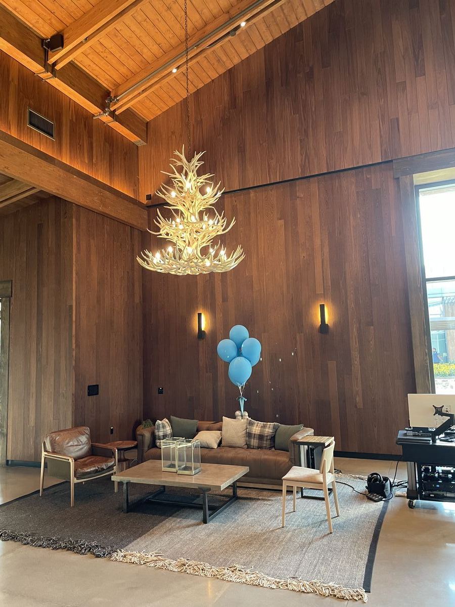 Bandwidth HQ — grand lobby with floor-to-ceiling wood paneling