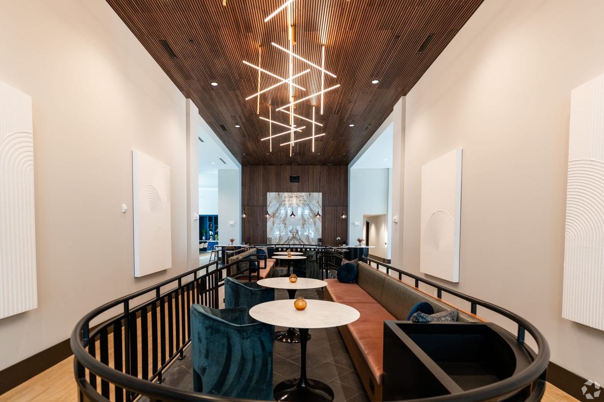 Preston Ridge — mezzanine lounge with wood slat ceiling